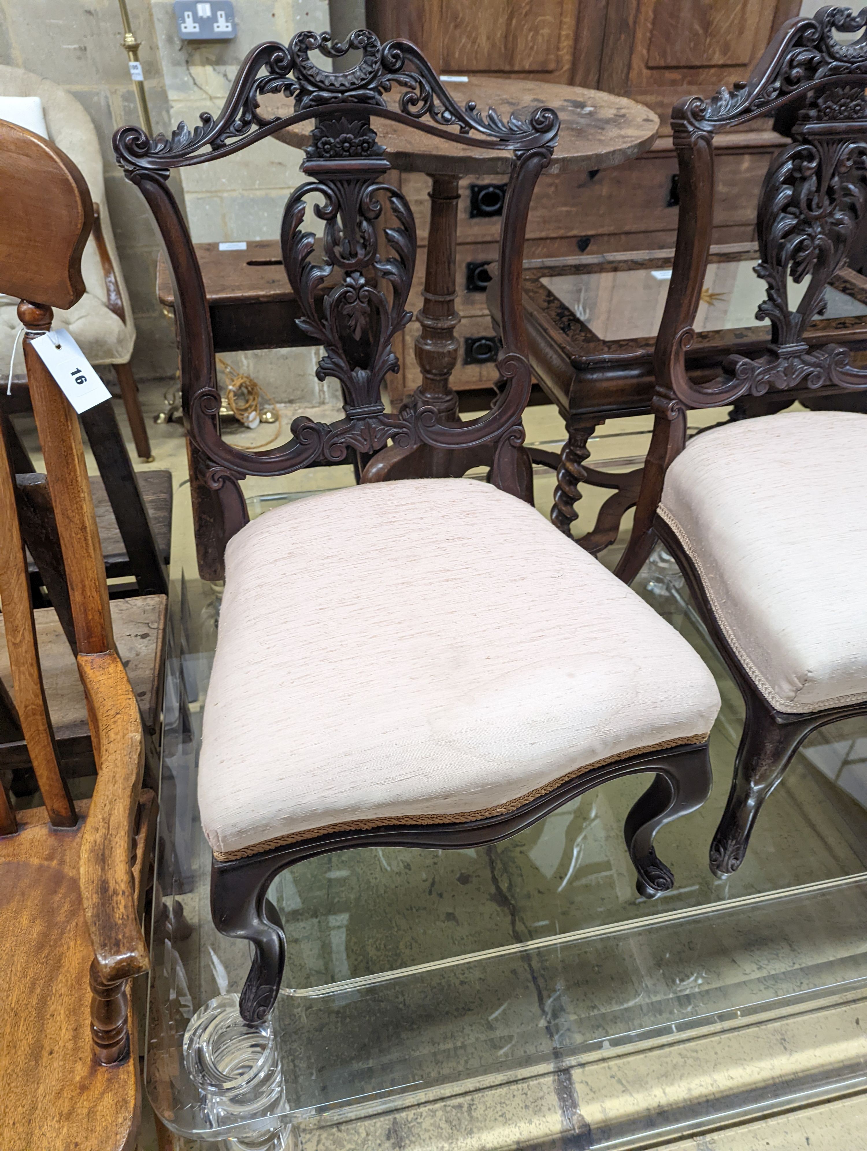 A late Victorian carved mahogany seven piece salon suite, settee length 140cm, depth 60cm, height 94cm